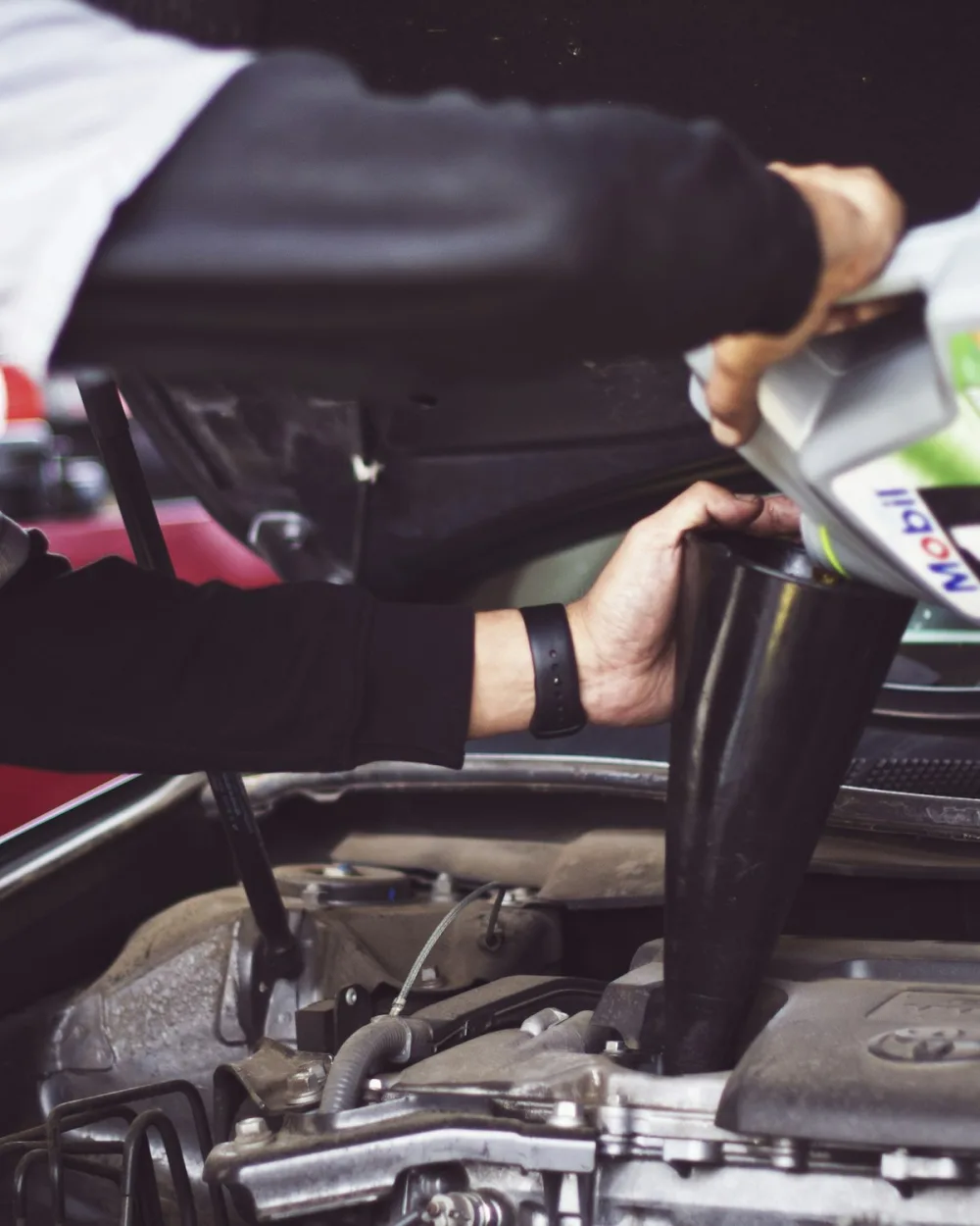 Auto repair technician inspecting a vehicle for Atlanta metro customers