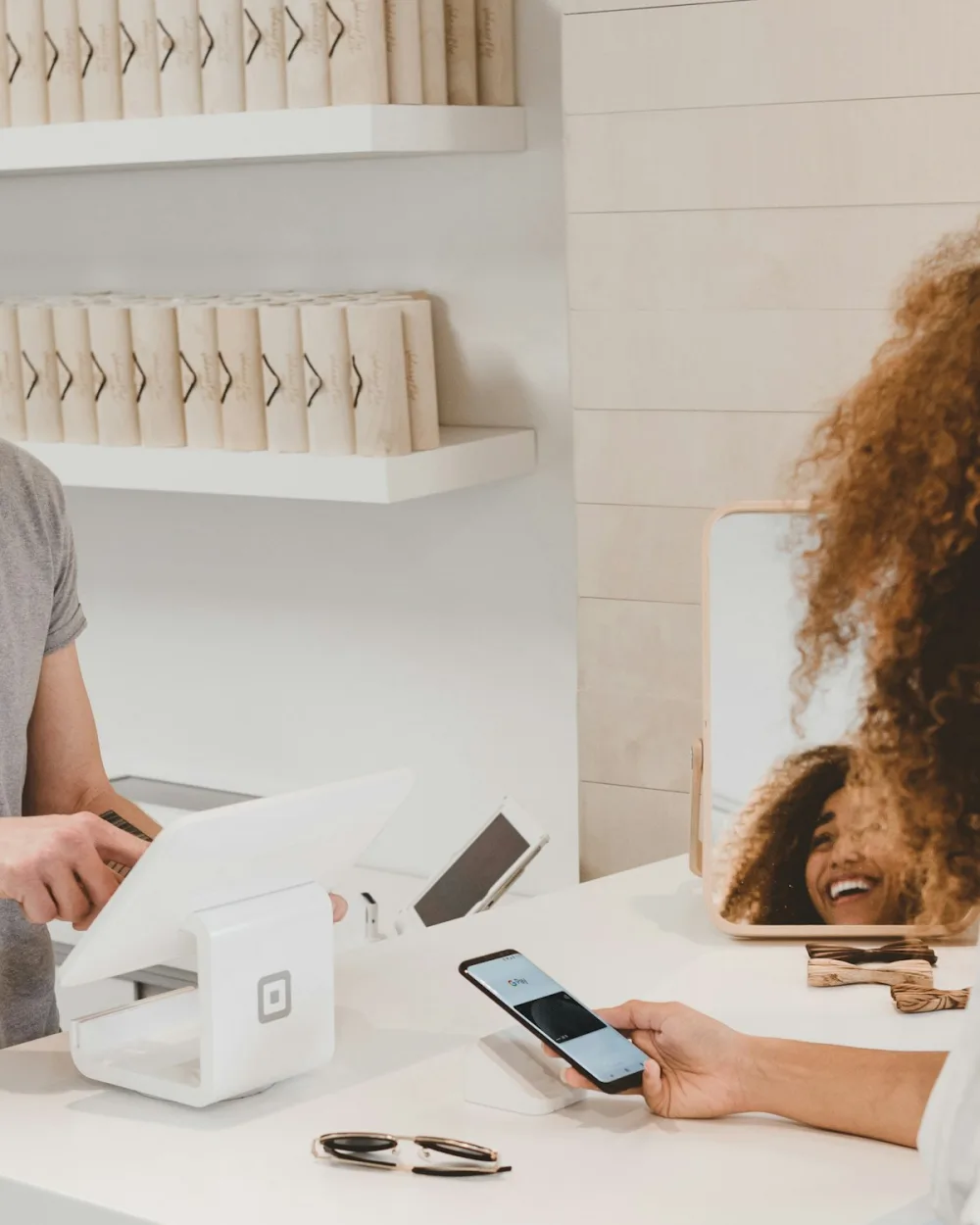 Retail checkout and shopping bags representing Dallas Shopify ecommerce design